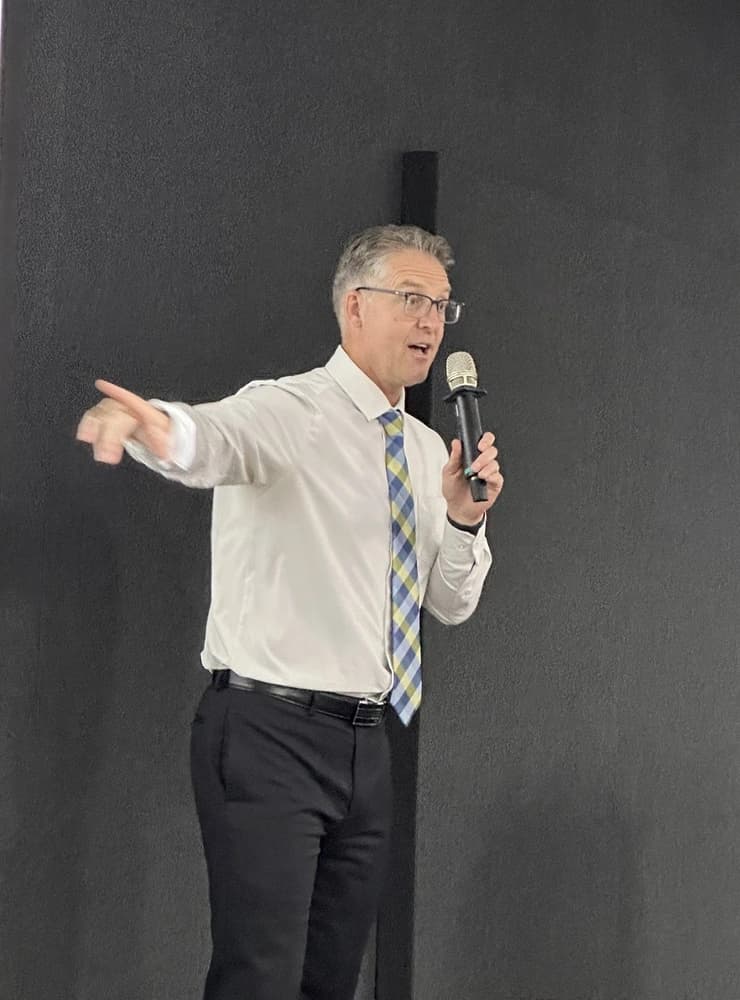 Dr. Michael Bennett speaking on stage