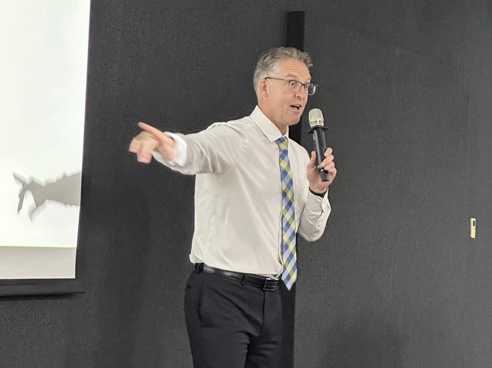 Michael Bennett, DDS, PhD speaking on stage