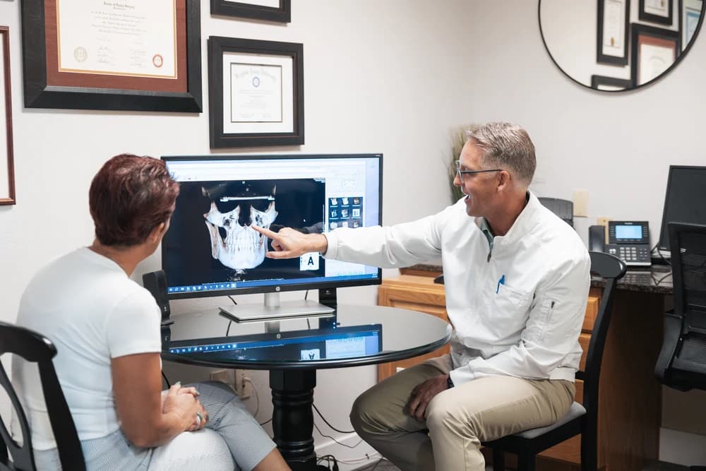 Dr. Bennett consulting with a patient at Advanced Dental Care